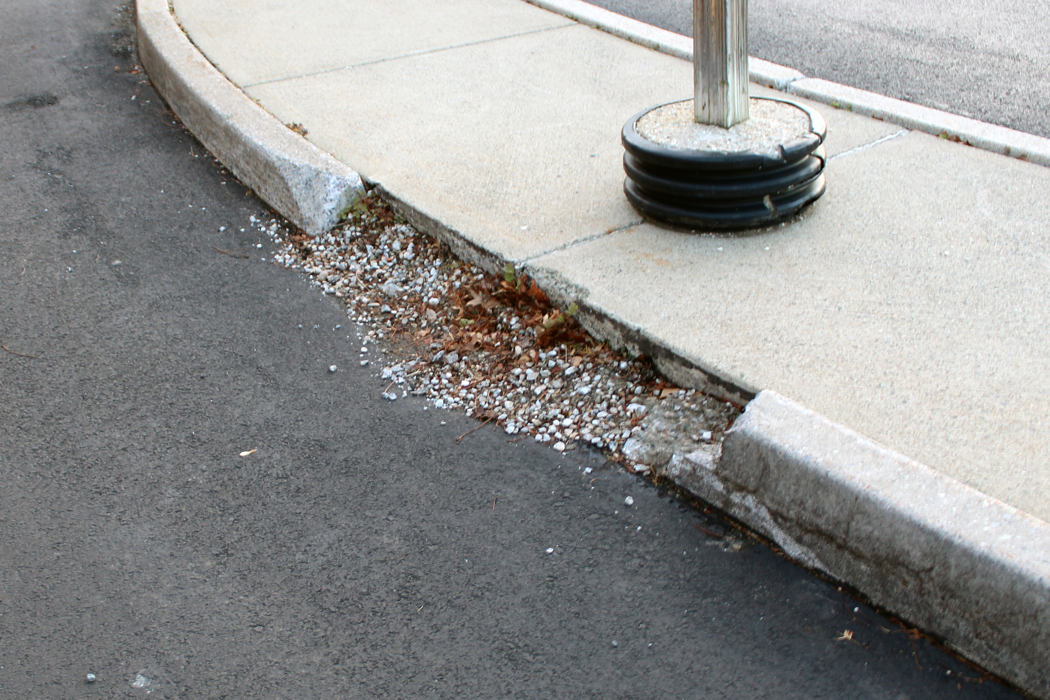 broken curbing at MED