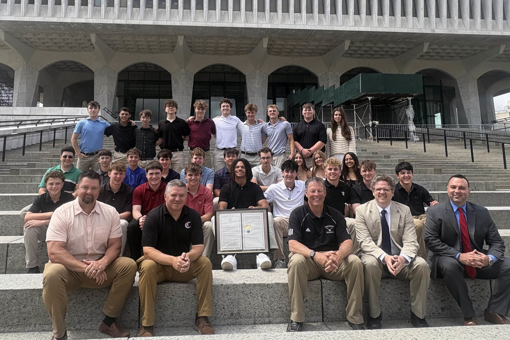 Chtham varsity baseball team an school officials pose for photo on steps in Albany