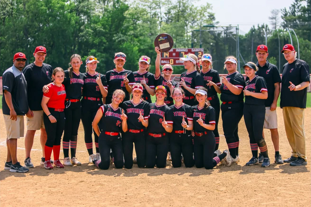 Chatham varstiy softball team hollding regional championship plaque